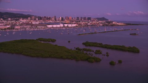 Honolulu, Oahu, Hawaii circa-2018. Aerial view of Keehi Lagoon at sunset. Shot with Cineflex and RED Epic-W Helium.