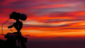 Professional camera taking picture film video of sunrise over sea surface, Greece Peloponnese, Time lapse 4K