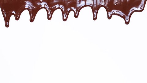 Melted chocolate syrup on white background. Liquid chocolate.Chocolate stream.