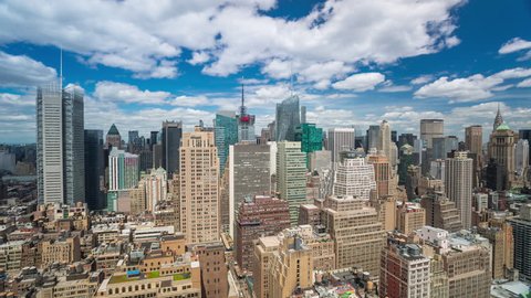 New York Manhattan Rooftop view Day Timelapse clouds passing by, tall buildings. from above