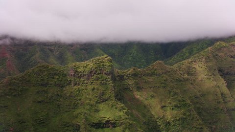 Kauai, Hawaii circa-2018, Aerial view of Kauai canyon with low clouds. Shot with Cineflex and RED Epic-W Helium.