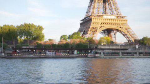 Defocused close up of historic French landmark and river. Close view of world famous Eiffel Tower and the River Seine in Paris France