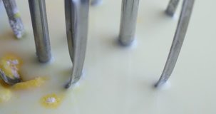Very close video of banana cream pudding being mixed with dual beaters.