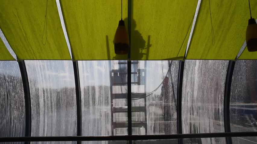 Window and glass cleaners at work. Cleaners wash glass bridge.  How to wash complex designs. Ready advertising campaign for cleaning companies. The video concept was made in June 2018. 