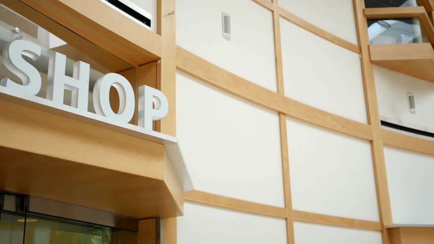 An overhead gift shop sign in a shopping mall
