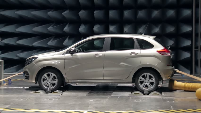 new automobile is standing in anechoic chamber for testing on car plant, walls covered by absorbers Royalty-Free Stock Footage #1011796655