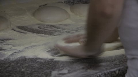 Stretching pizza dough with hands