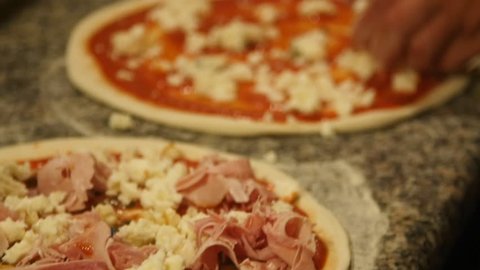 Seasoning pizza with mozzarella cheese