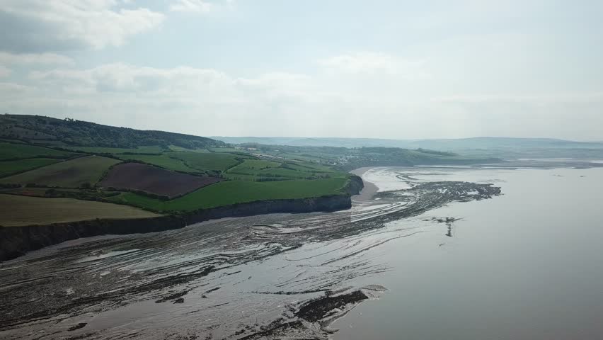 Aerial of Rocky Jurrasic beach near Kilve Somerset England with many fossils 