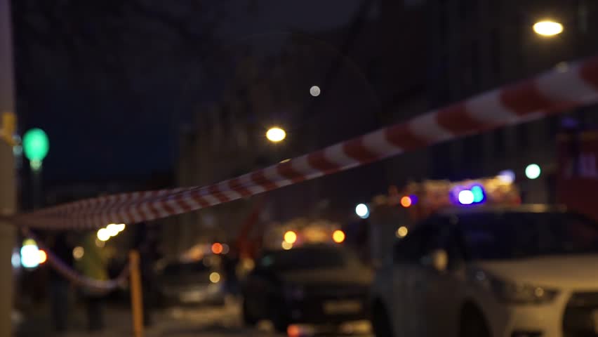 Police Tape, Flashing Lightbar, Blue and Red Lights with firetruck in background at scene of fire Royalty-Free Stock Footage #1011803321