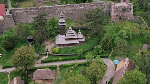 Aerial view museum of Folk Architecture and Life is an open-air museum located in Uzhhorod, Ukraine. It features over 30 traditional structures collected from villages across Zakarpattia Oblast.