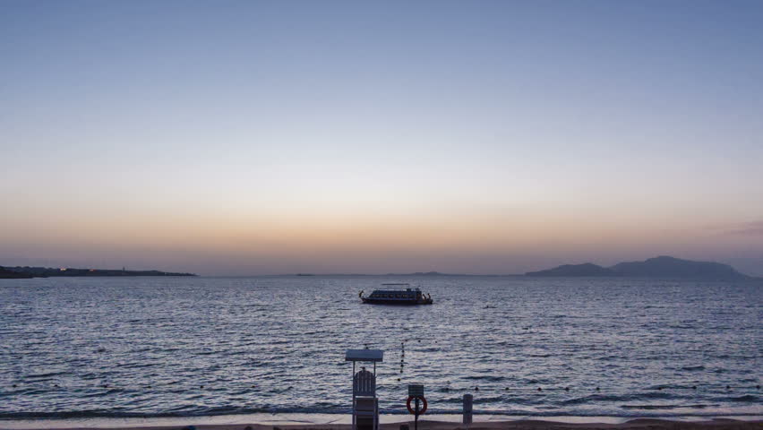 Amazing sunrise over the beach. Nature is waking up. Time lapse. Camera is zooming.