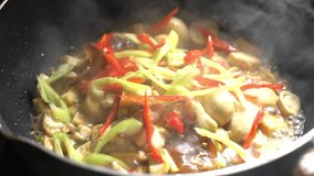 Slow motion clip: Thai tradition vegetarian food: Stir mix mushrooms and tofu with holy basil.  Spicy food Thai style. Shoot in studio, Clean food good taste idea concept.