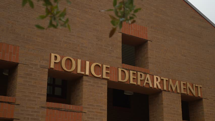 Police department building on a cloudy day Royalty-Free Stock Footage #1011818618