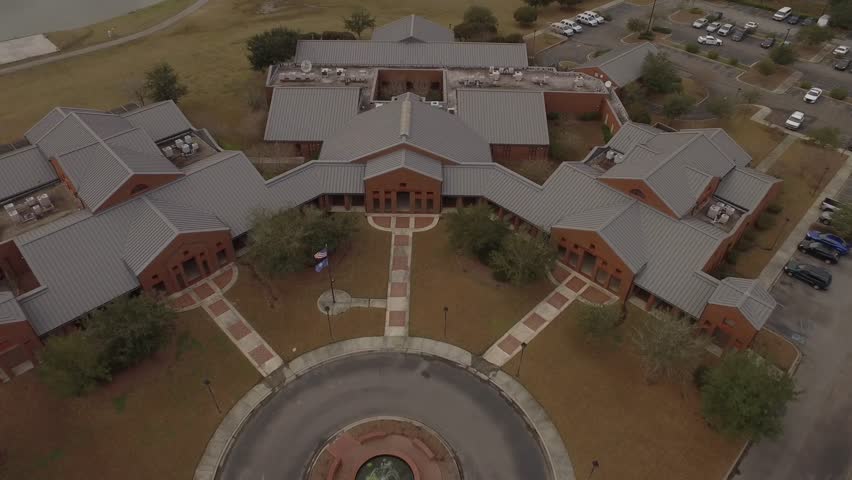 Police station headquarters building from an overhead aerial perspective.