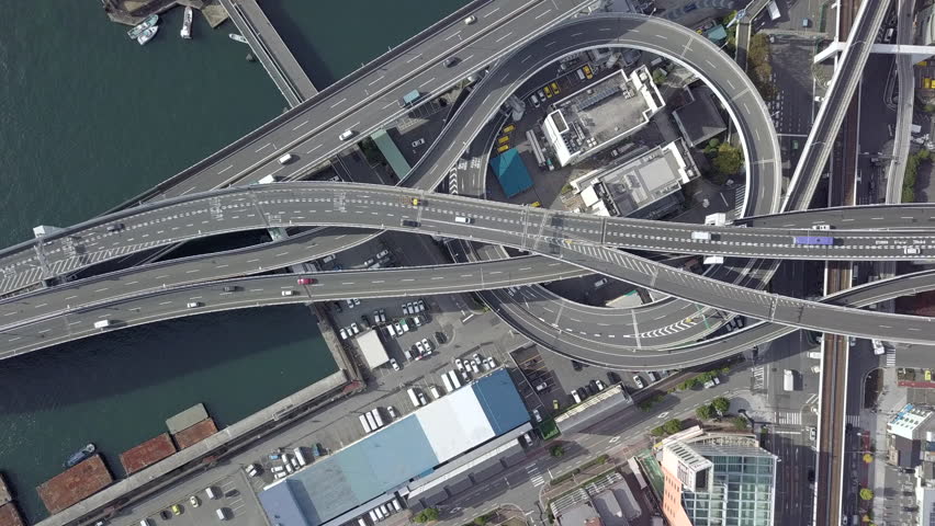 Aerial top view infrastructure architecture in Osaka City, Intersection highway, expressway and motorway, Aerial view overhead many car in interchange transportation Osaka City, Osaka, Kansai, Japan. | Shutterstock HD Video #1011819101