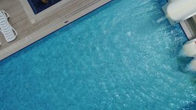 Aerial view of resort pool with kids in fun