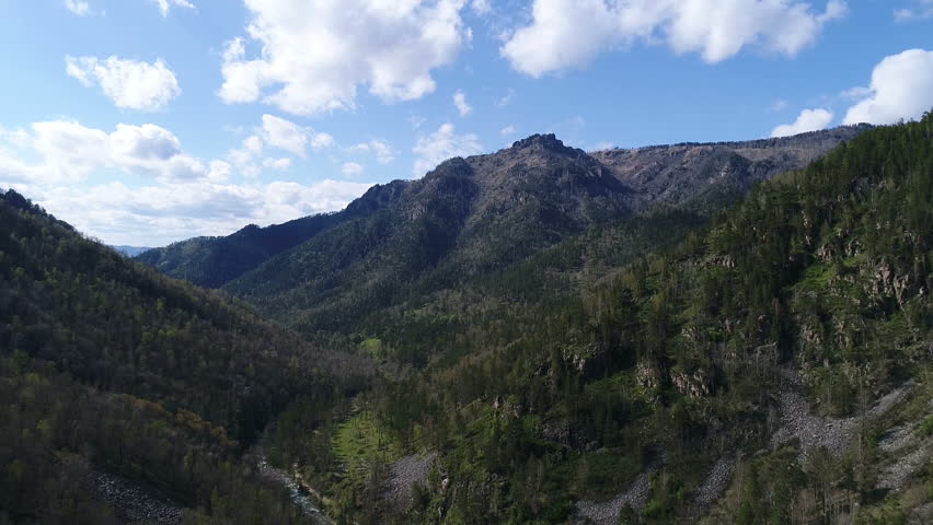 Aerial View. Flight over the Mountains. Altai. Siberia. Altai is situated in the very center of Asia at the junction of Siberian taiga, steppes of Kazakhstan and semi-deserts of Mongolia