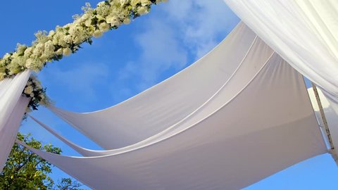 Beautiful static video 4k of the Jewish Hupa , wedding putdoor .Beautifully registered Huppa with a set of flowers.