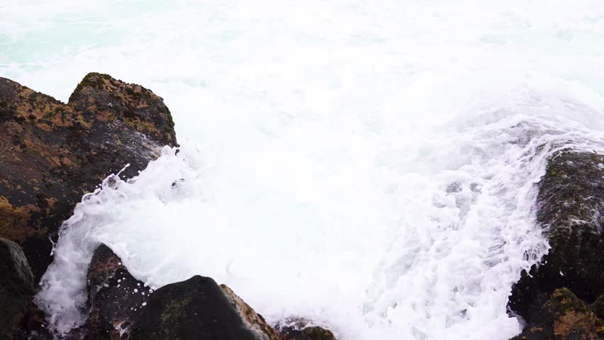 waves break over stone on beach Stock Footage Video (100% Royalty-free ...