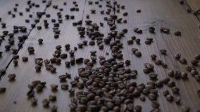 Beautiful footage of coffee beans on wood
