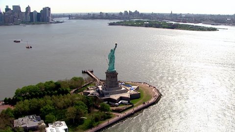 Aerial flyby close up of statue of liberty on a clear summer day mark symbol of freedom and independence in America