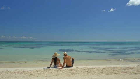 Couple On White Sand Beach