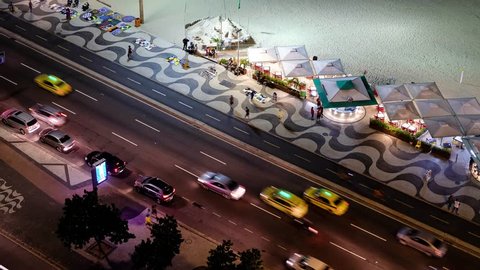 Time Lapse Of Night Traffic On Copacabana beach next to the kiosks, Rio de Janeiro, Brazil