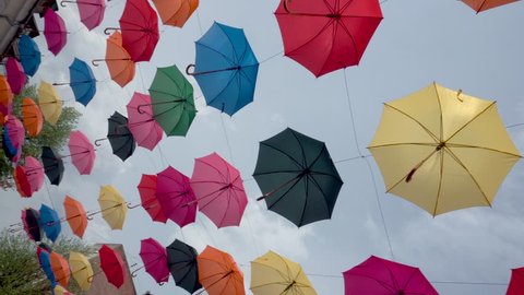 Colorful umbrellas background in urban, umbrellas in the sky, street decoration