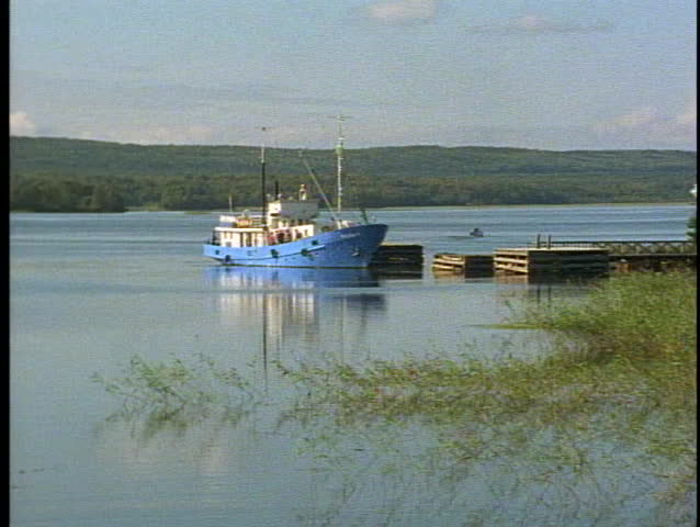 RUSSIA, 1999, Small boat, in lake, reeds, nicely framed, peaceful, in Russia on Kizhi Island