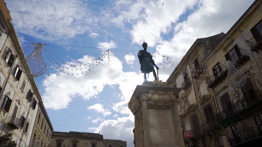Statue of a man on the street of a European city. Stock. Man statue