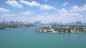 Aerial shot over beautiful homes by the water in Miami, Florida