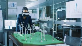 Futuristic Female Engineer using Virtual Reality Environment for Designing and Testing Wind Turbines in 3D. Renewable Energy Concept. Shot on RED EPIC-W 8K Helium Cinema Camera. - Powered by Shutterstock - Get 15% off with code: PIKWIZARD15