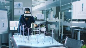 Futuristic Female Engineer Wearing Virtual Reality Glasses, Designs in 3D Field with Wind Turbines. Renewable Energy Expert Does Technological Efficiency Testing. Shot on RED EPIC-W 8K Helium Camera. - Powered by Shutterstock - Get 15% off with code: PIKWIZARD15
