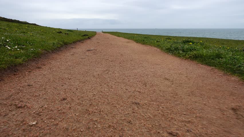 The walking road on the mountain over the Atlantic Ocean. La Coruna, Spain.