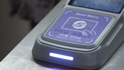 SEOUL, SOUTH KOREA - MAY 28, 2018: People Use Card to Pass Through Pay Gate in Subway
