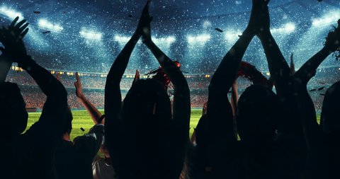 Fans clapping hands to cheer their favorite sports team on the stands of the professional stadium while it's snowing. Stadium is made in 3D and animated.