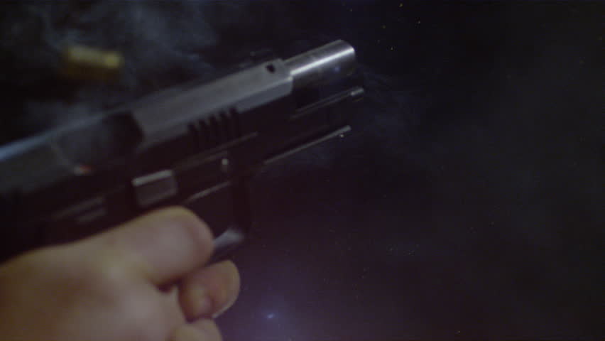 Close up of an automatic gun firing