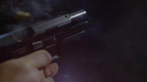 Close up of an automatic gun firing