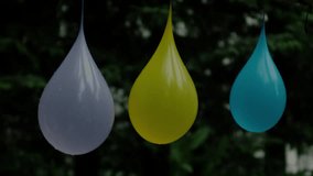 Three water balloons shot with arrow, Ultra Slow Motion - Powered by Shutterstock - Get 15% off with code: PIKWIZARD15