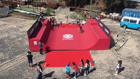 Learning To skate A Halfpipe. LISBON, PORTUGAL - 05 MAI 2018; Teenagers learning how to skate on a halfpipe in a park. High angle view