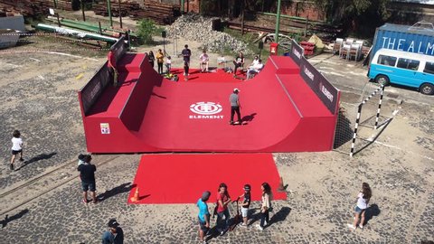 Skateboard Halfpipe Practicing Kids. LISBON, PORTUGAL - 05 MAI 2018; Teenagers learning how to skate on a halfpipe in a park. High angle view