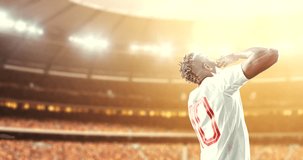 Soccer player celebrates a victory and air-kisses happily on the professional stadium while the sun shines. Stadium and crowd are made in 3D and animated.