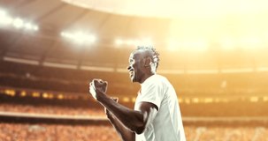Soccer player celebrates a victory and air-kisses happily on the professional stadium while the sun shines. Stadium and crowd are made in 3D and animated.