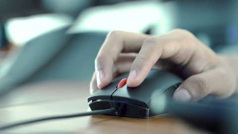 Businessman clicking digital mouse and working on computer at the office.Close up hand on mouse.The concept of using technology for rapid success.Computer lab.Cyber business.4k