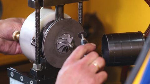workers hands car turbine repair