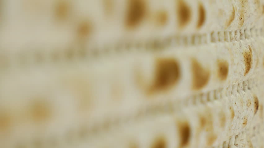 Passover or Pesach matzah is a traditional jewish holiday bread for passover. Pesach celebration symbol. Vertical format video. | Shutterstock HD Video #1011959564