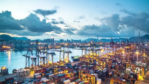 timelapse of hongkong international container port during sunrise
