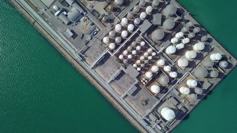 Aerial view tank farm terminal for storage crude oil and gas LPG building construction, Business commercial industry power and energy fuel petrochemical import export logistic tanker cargo ship boat.