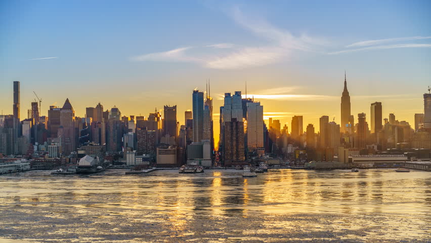 Midtown Manhattan skyline at sunrise in New York, timelapse of rising sun Royalty-Free Stock Footage #1011969329
